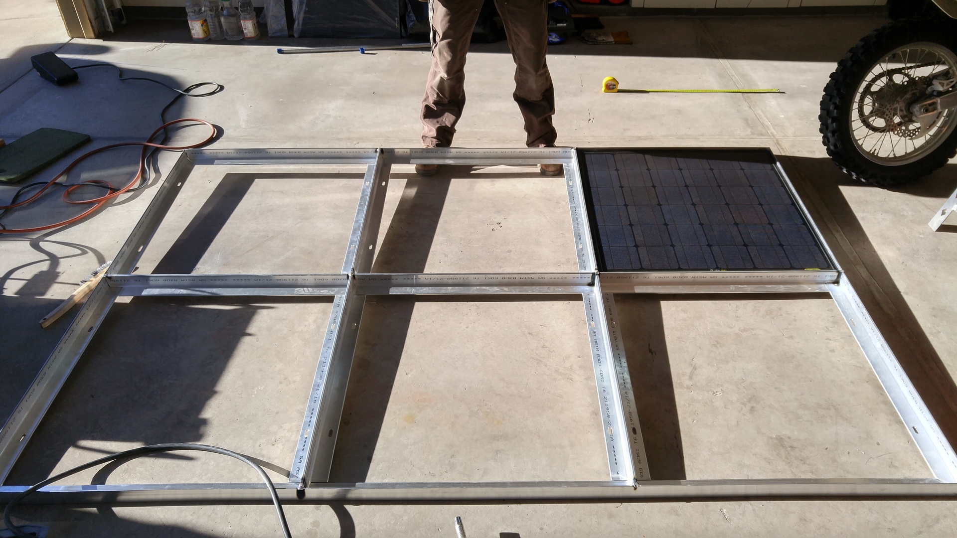 Checking the fit of a single Boulder 90 solar panel after tack-welding the frame.