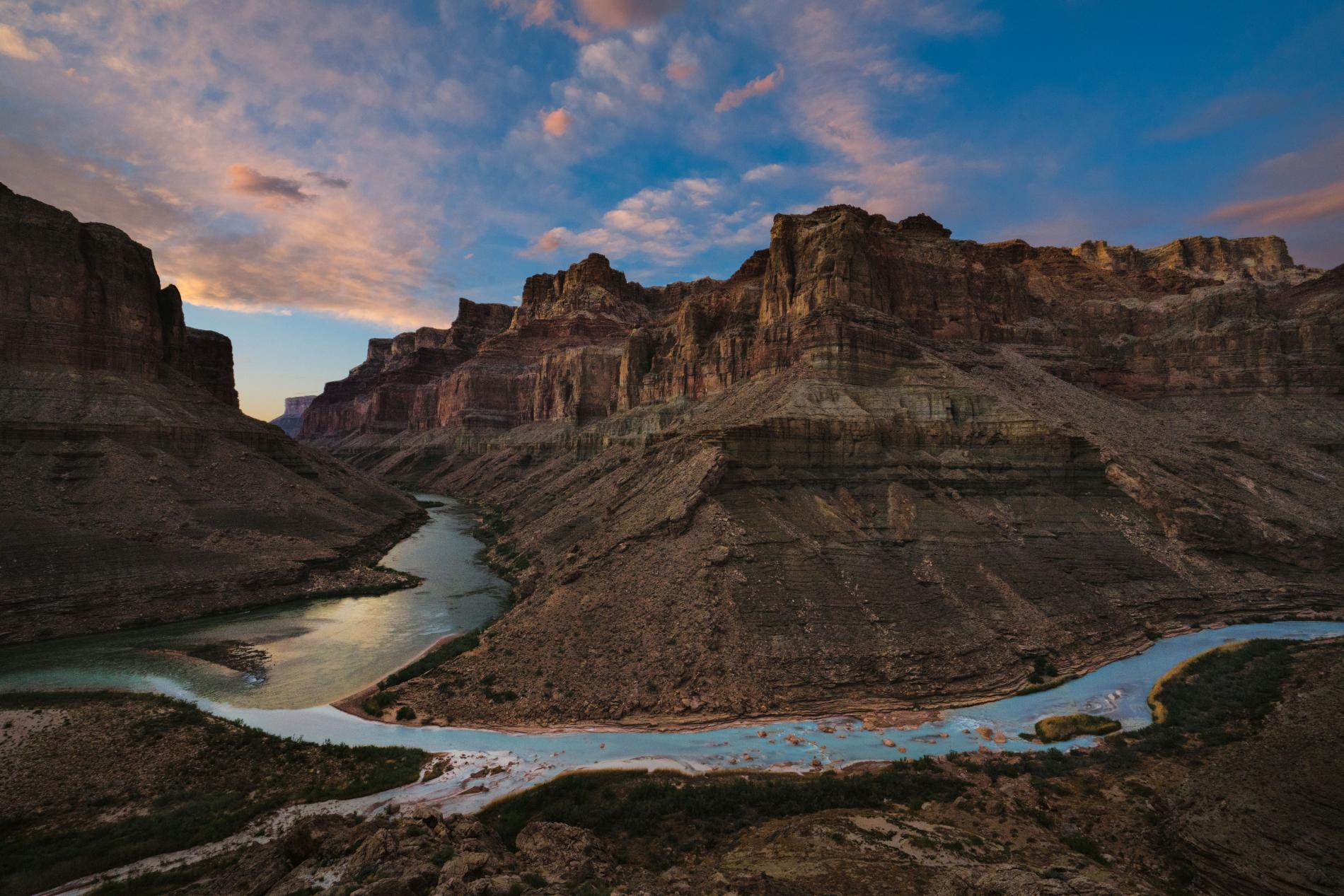 Local tribes regard the Confluence, where the Little Colorado’s blue waters merge with the Colorado, as sacred. Developers hope to build a tramway here to carry up to 10,000 tourists a day to a riverside retail and food complex. - National Geographic / Pete McBride
